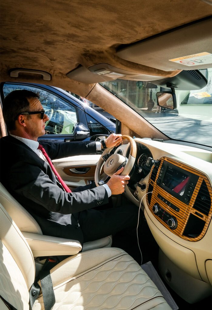 Home 14 Professional Chauffeur Driving Luxury Vehicle