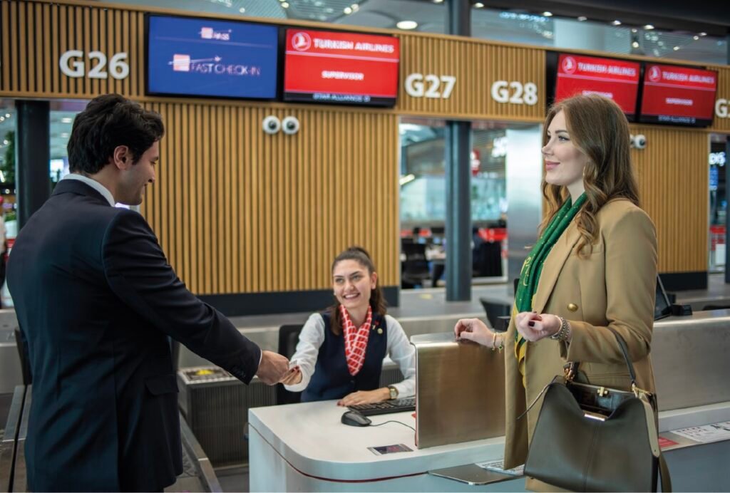 Istanbul Airport Pick Up Service 1 Business traveler receiving assistance at an airport check-in or information desk