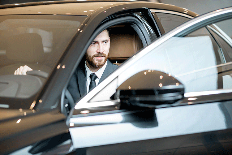 Airport Luxury Taxi Service 1 A friendly and professional Limousine Plus chauffeur opening the door of a luxury vehicle, ready to provide excellent service in Istanbul.